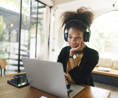 negative facial expression Young adult businesswoman mixed-race American  a bit exhausted after a Long video call and remote working  conference with team diverse colleagues,