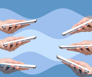 Six woman’s hands holding smart phones