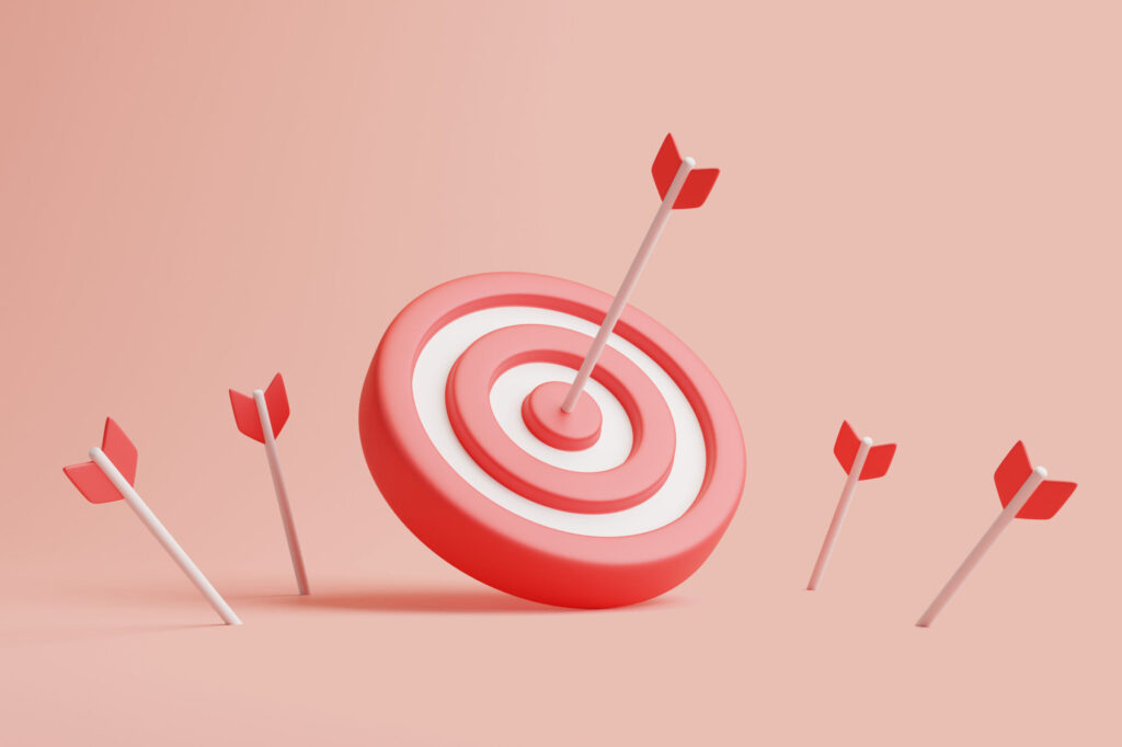 Arrows-hit-the-center-of-a-red-dartboard-on-a-pastel-background