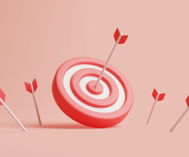 Arrows-hit-the-center-of-a-red-dartboard-on-a-pastel-background