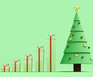 Growth graph made of taller and taller gifts with last pillar being a Christmas tree