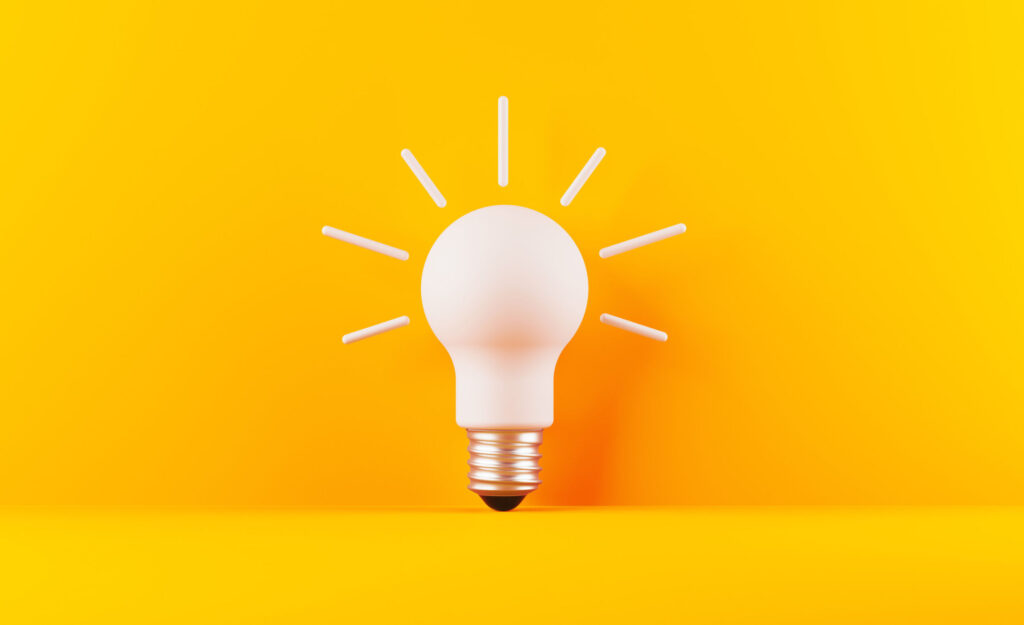 Light-Bulb-On-Yellow-Background