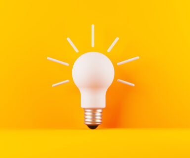 Light-Bulb-On-Yellow-Background