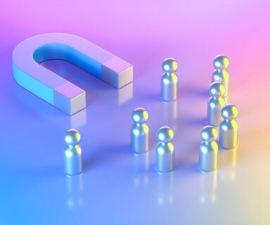 Magnet-with-Group-of-Pawn-People-on-Neon-Lighting-Background-Blue-Pink-Yellow-Colors