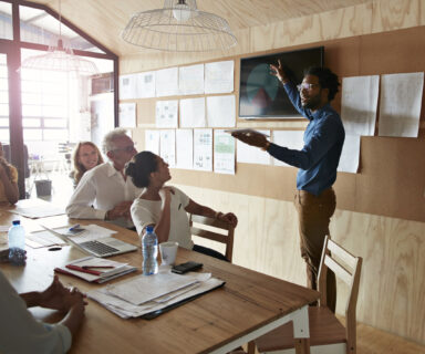 Man-doing-presentation-using-tablet-screen