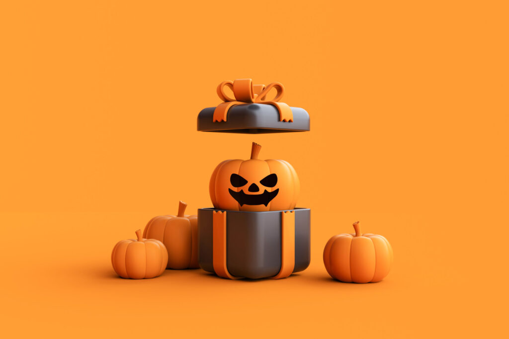 Opened gift box with Halloween Jack-o-Lantern pumpkin wearing witch hat on orange background.