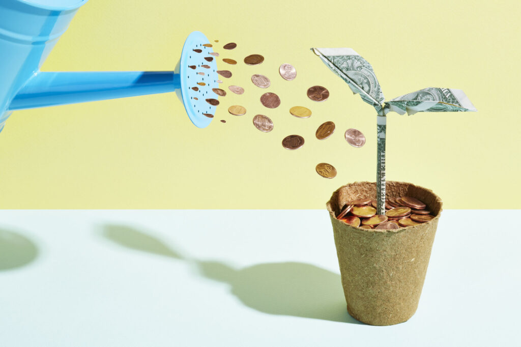 Origami-dollar-seedling-being-watered-with-coins