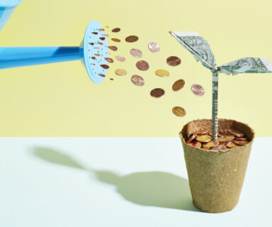 Origami-dollar-seedling-being-watered-with-coins