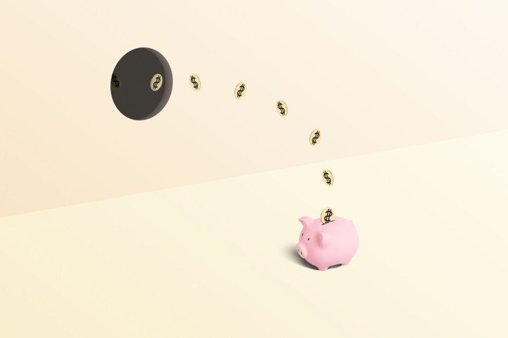 Piggy-bank-being-stuffed-with-money