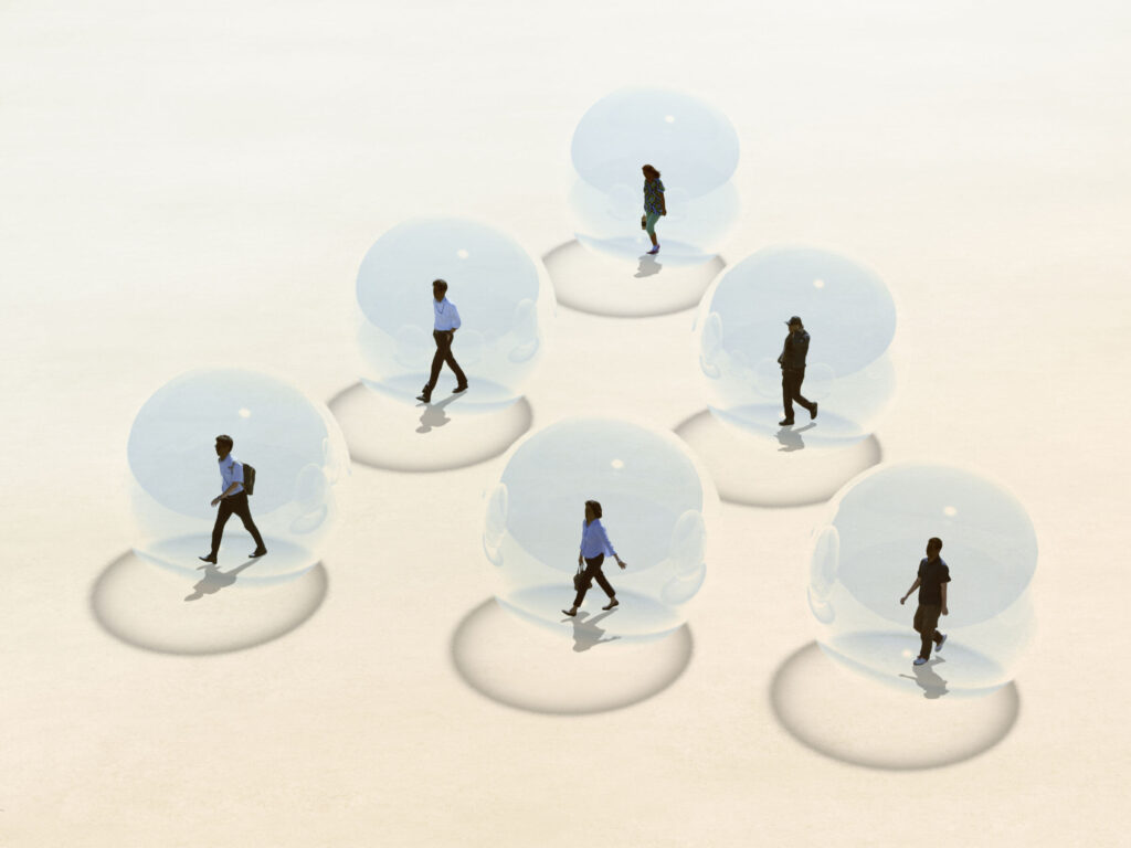 Social Distancing. People walking through the square in a transparent sphere.