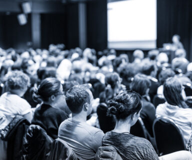 Speaker-giving-presentation-on-scientific-business-conference.