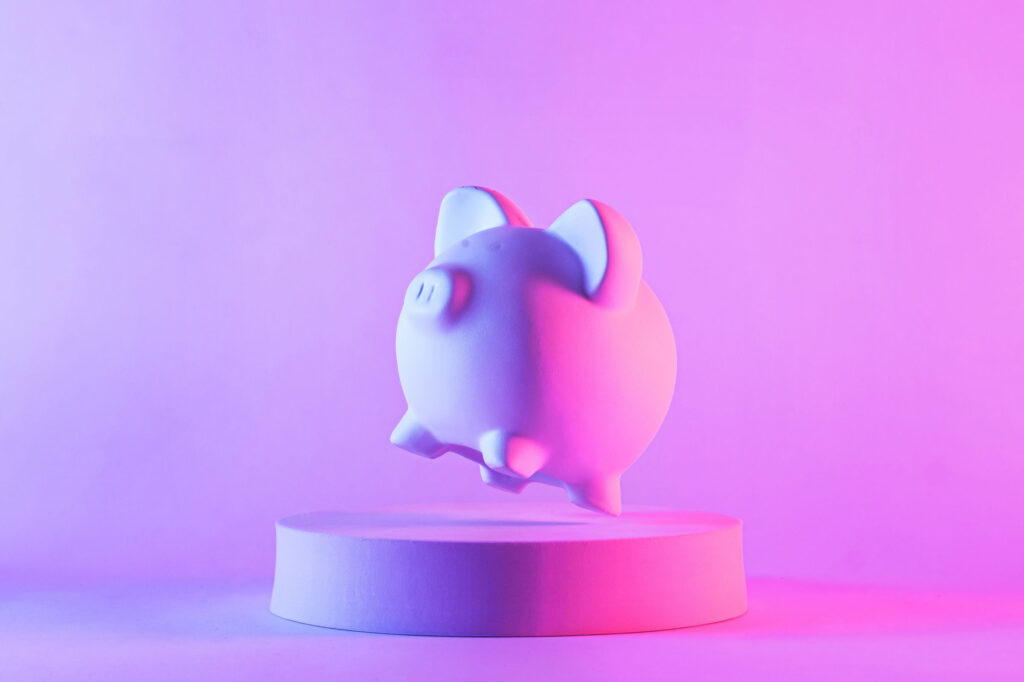 Studio-close-up-of-piggy-bank-floating-above-a-round-podium