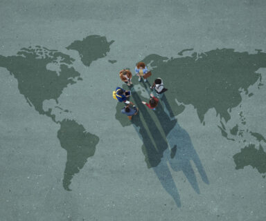 Top-view-of-group-of-people-standing-on-worldmap-painted-on-asphalt