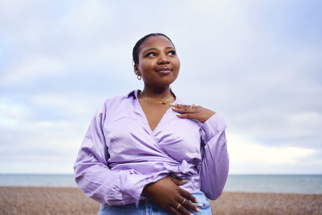 Woman-standing-confidently-alone-at-the-beach