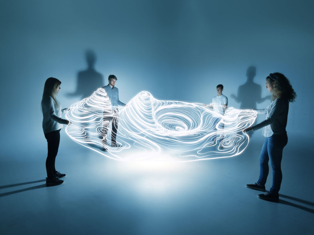 young people holding a lighttrace carpet