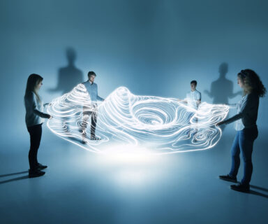 young people holding a lighttrace carpet